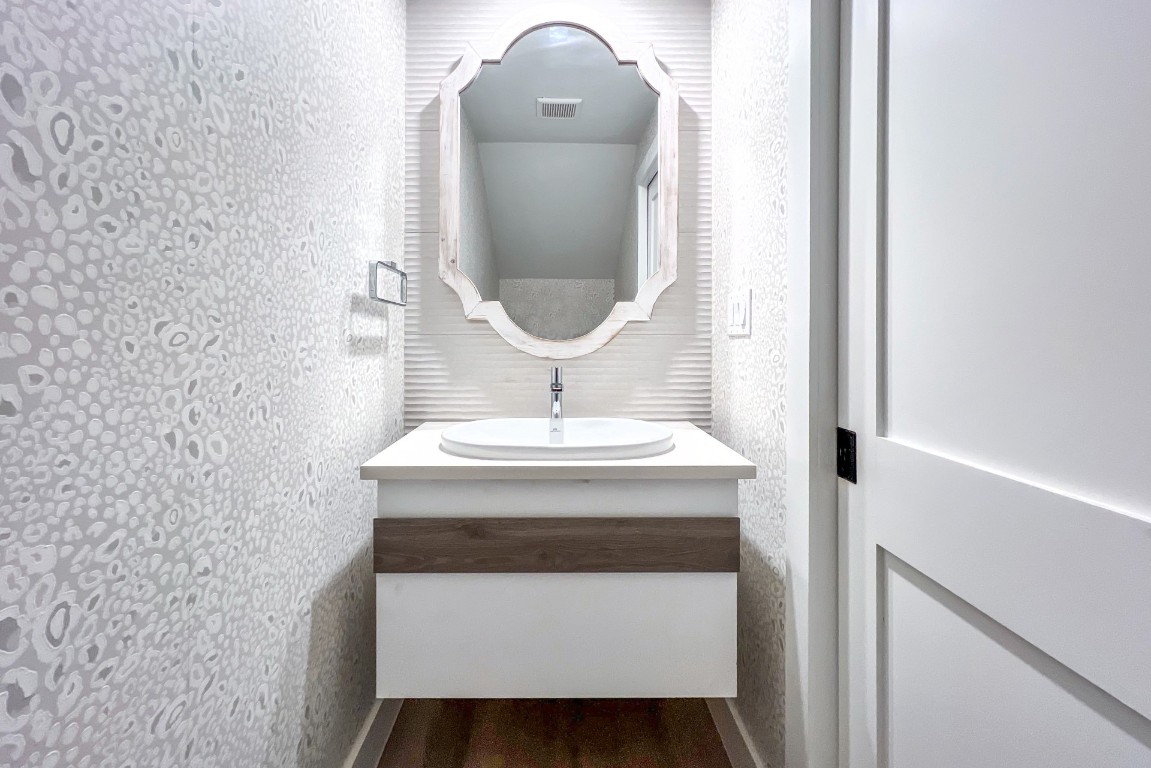 3422 Sea Marsh Road Fernandina Beach, FL 32034 - Photo 34 of 42 a bathroom with a sink and a mirror