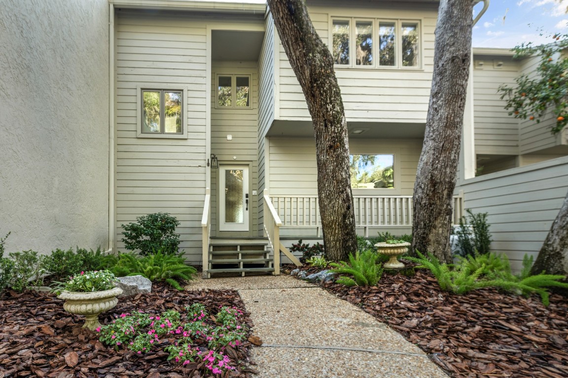 3422 Sea Marsh Road Fernandina Beach, FL 32034 - Photo 36 of 42 a front view of a house with garden