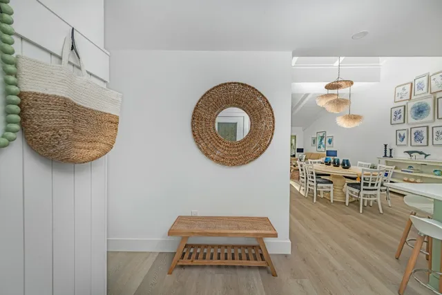 a living room with furniture and a clock