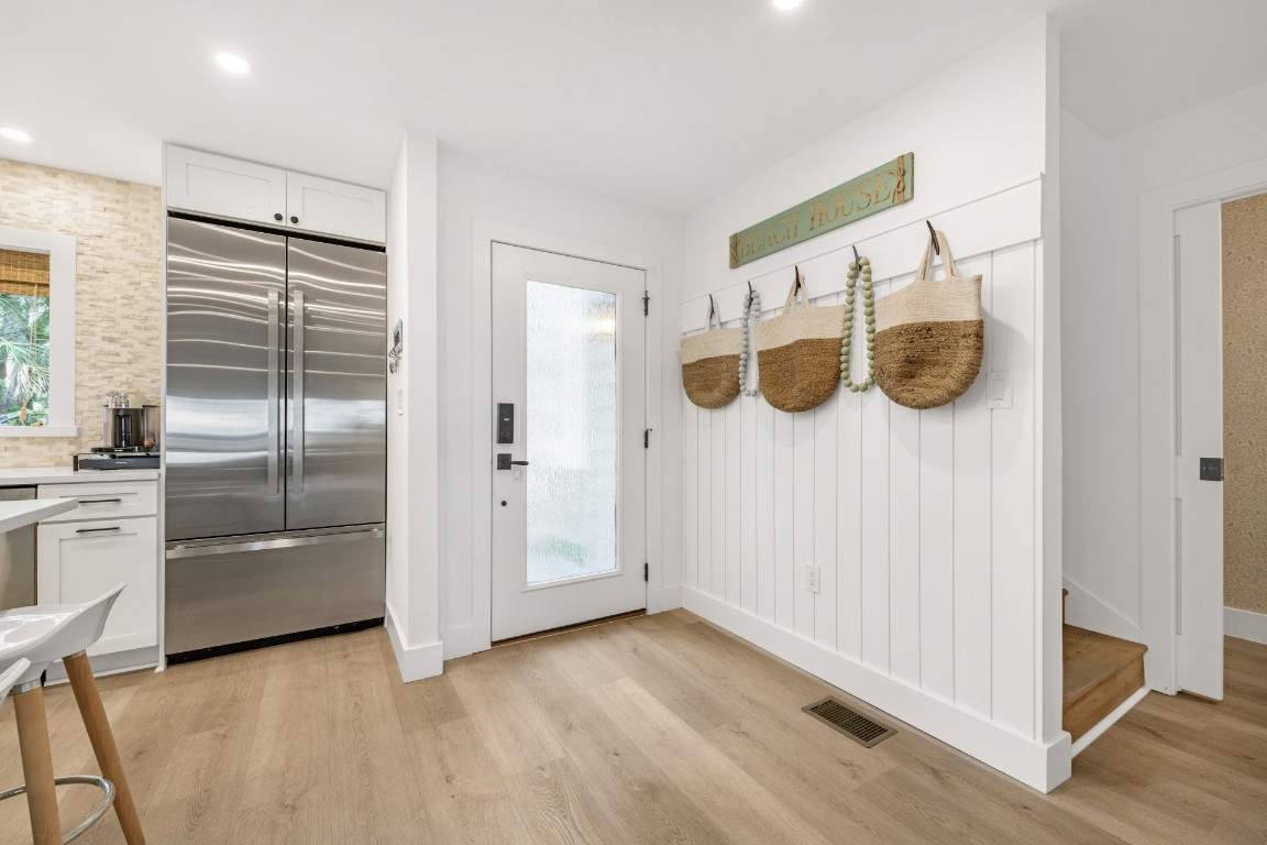 3422 Sea Marsh Road Fernandina Beach, FL 32034 - Photo 9 of 42 a view of a kitchen with wooden floor and electronic appliances
