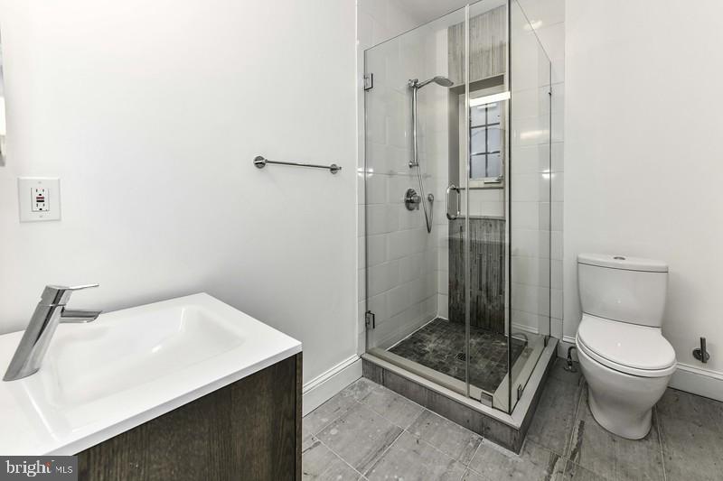 3222 Klingle Road Northwest Washington, DC 20008 - Photo 22 of 46 a bathroom with a sink toilet and shower