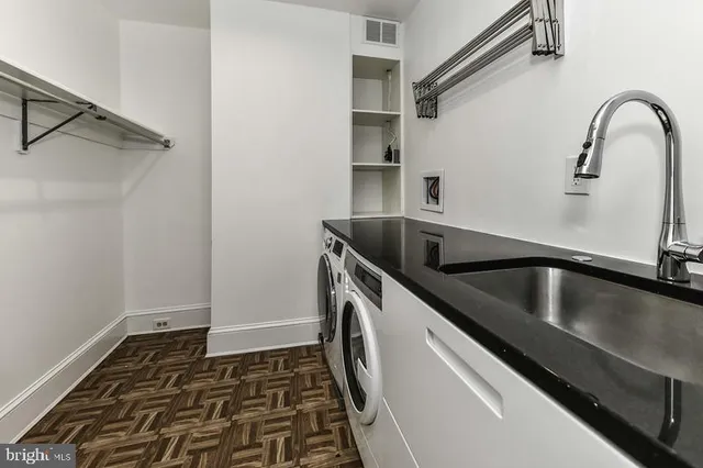 a view of a room with wooden floors and window