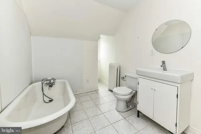 a view of wooden floor and a sink in a room