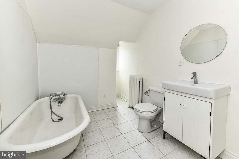 3222 Klingle Road Northwest Washington, DC 20008 - Photo 29 of 46 a bathroom with a sink a toilet and a mirror