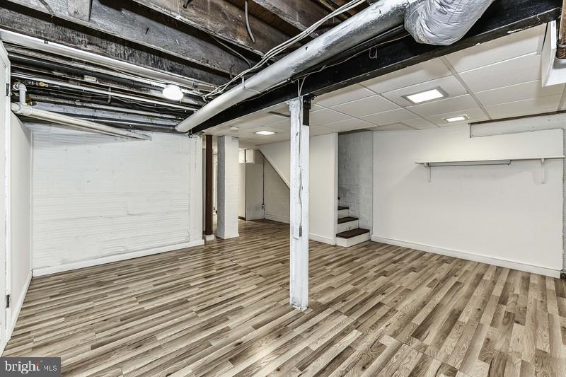 3222 Klingle Road Northwest Washington, DC 20008 - Photo 32 of 46 a view of a hallway with wooden floor