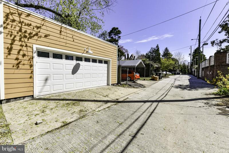 3222 Klingle Road Northwest Washington, DC 20008 - Photo 39 of 46 a view of a house with snow on the road