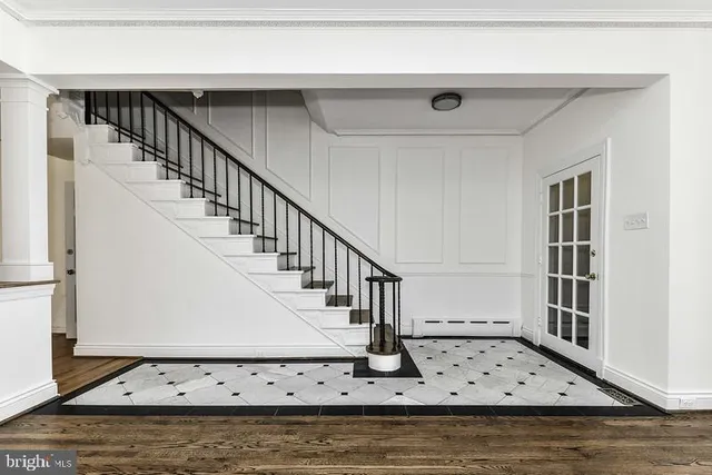 a view of entryway with wooden floor