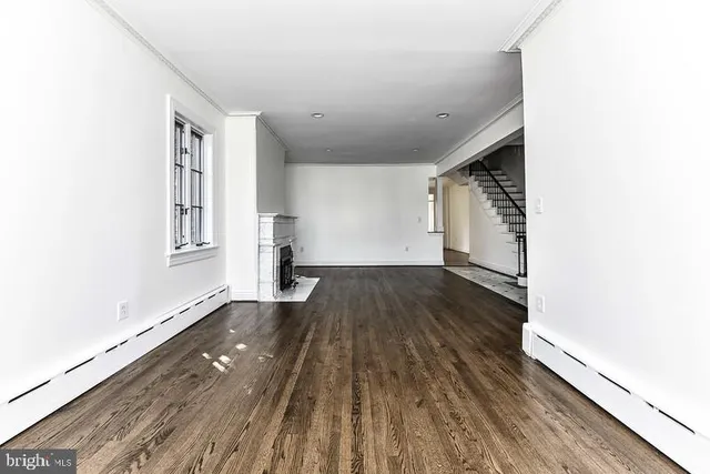 a view of wooden floor in an empty room