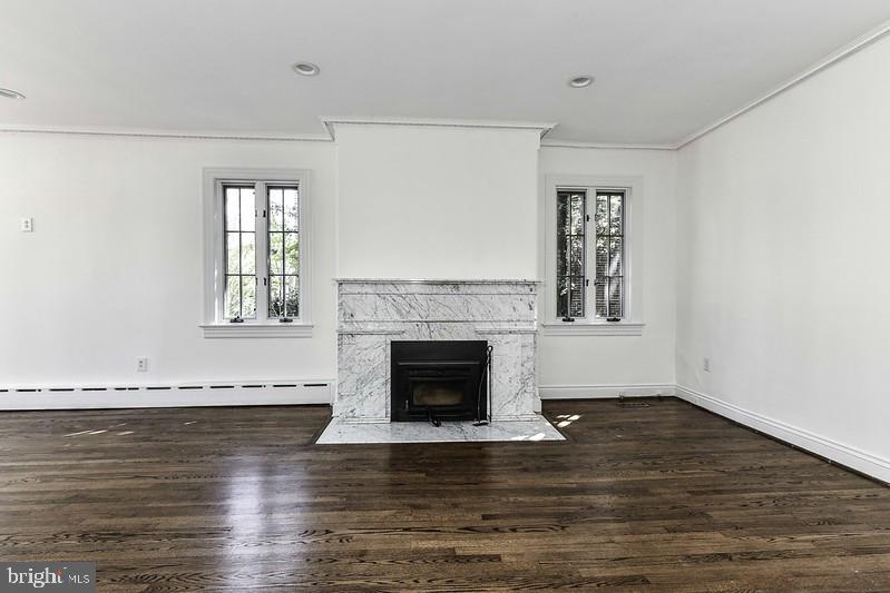 3222 Klingle Road Northwest Washington, DC 20008 - Photo 6 of 46 a view of wooden floor fire place and windows in a room
