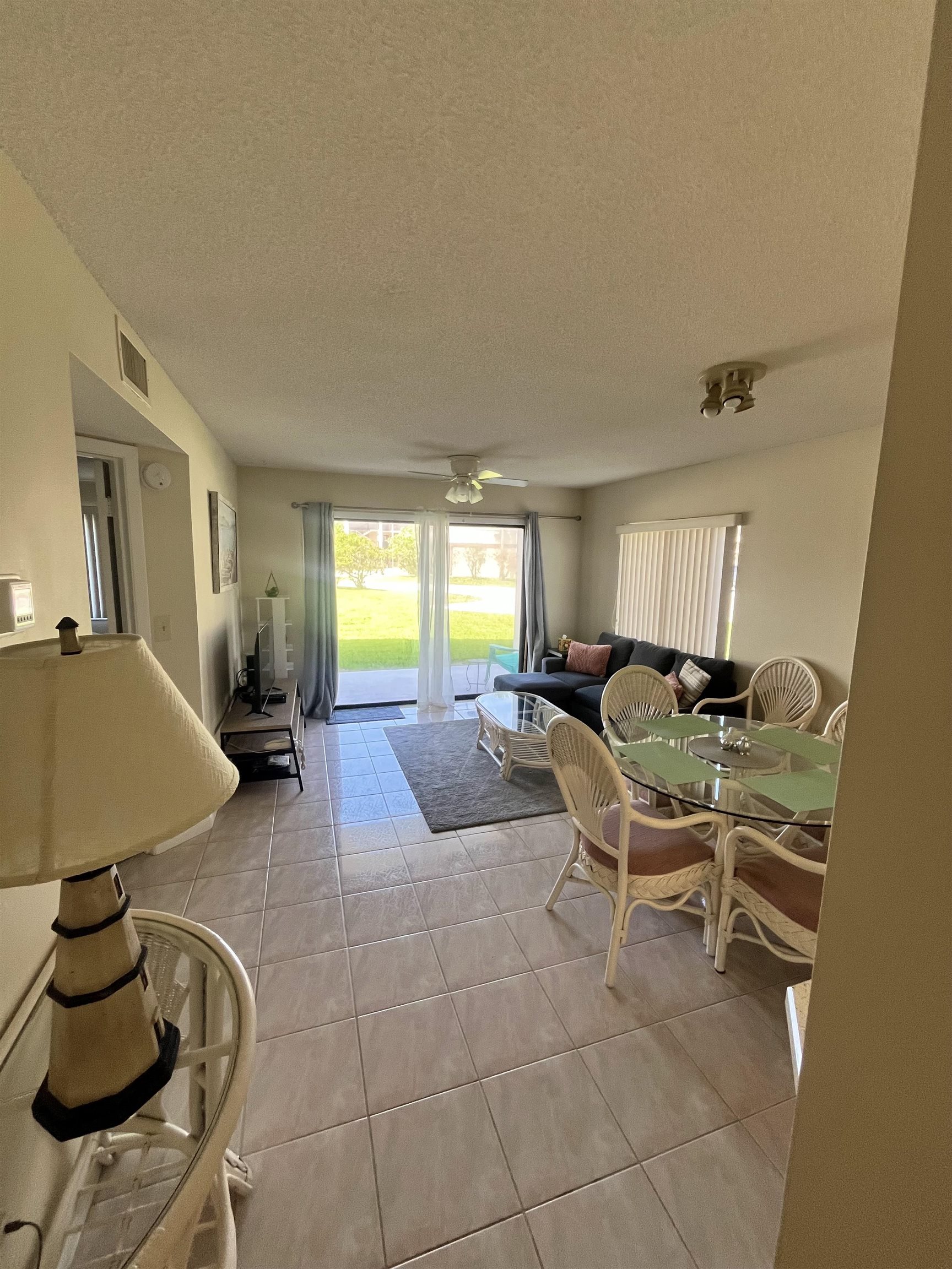 4250 A1A South, Unit C12 St. Augustine, FL 32080 - Photo 3 of 15 a living room with furniture and a wooden floor