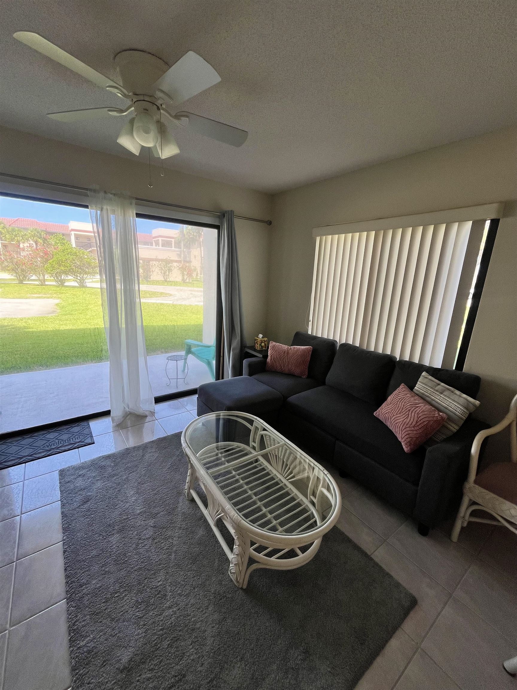 4250 A1A South, Unit C12 St. Augustine, FL 32080 - Photo 6 of 15 a living room with furniture and a flat screen tv