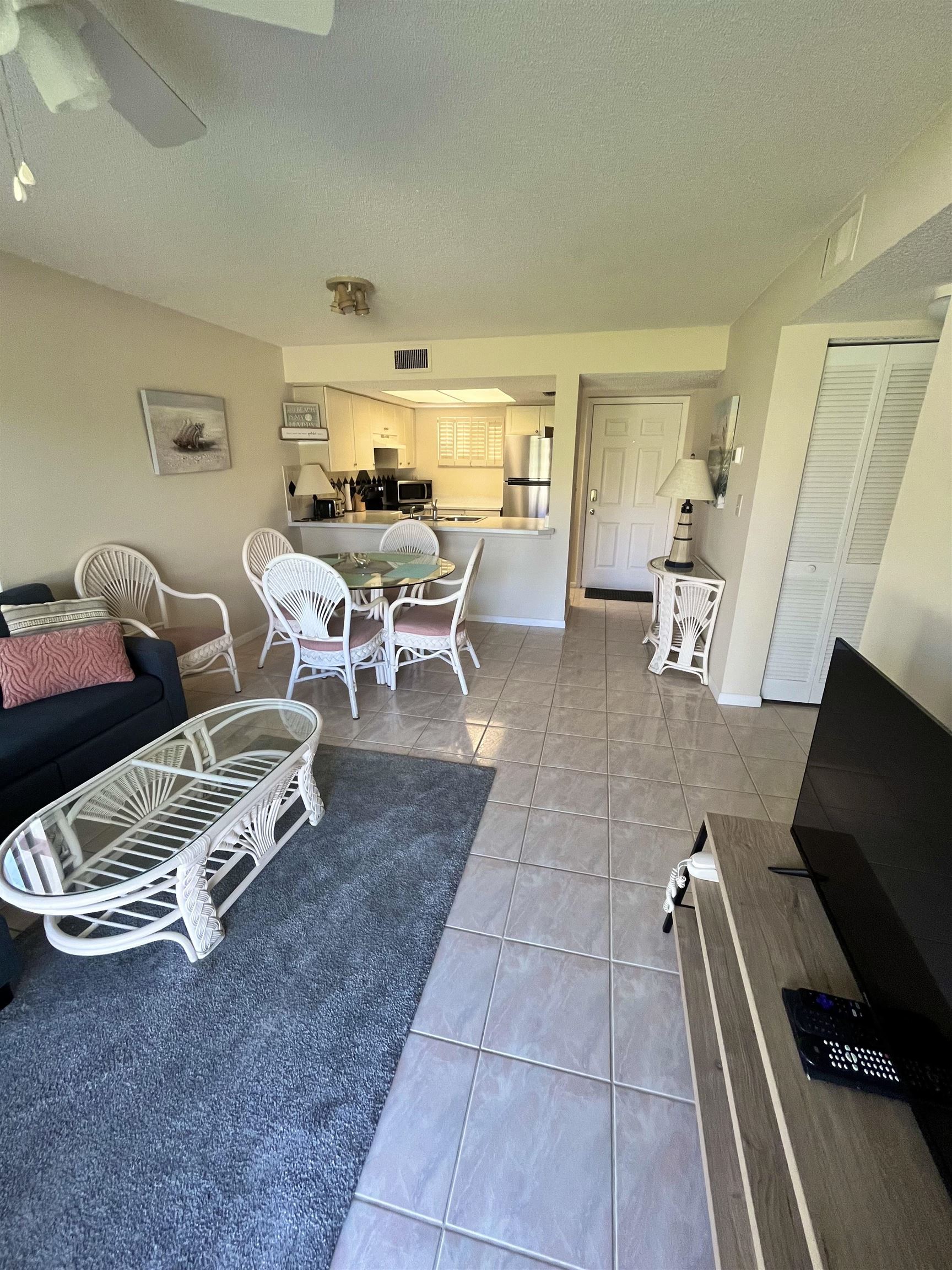 4250 A1A South, Unit C12 St. Augustine, FL 32080 - Photo 7 of 15 a living room with furniture and a flat screen tv