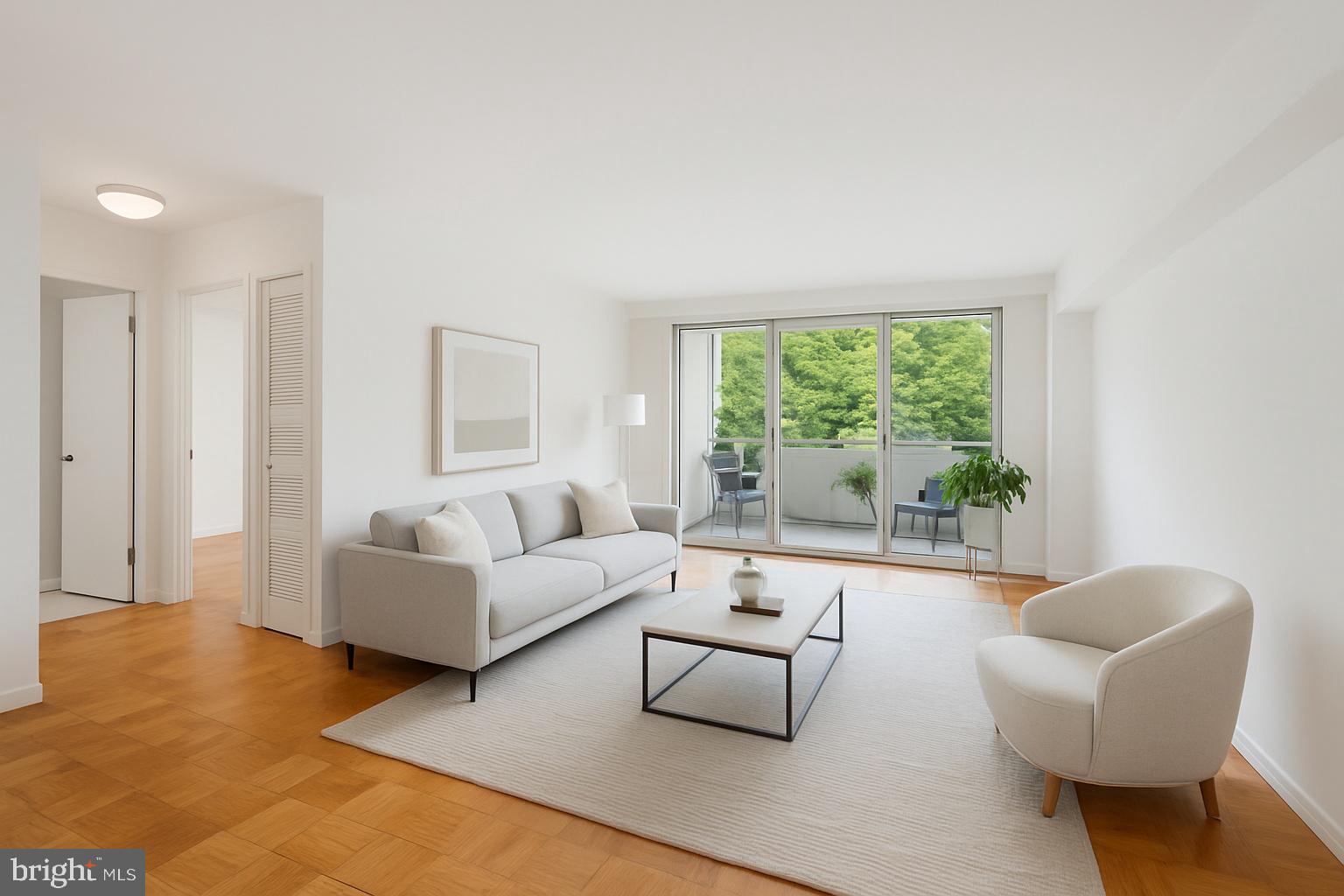 2939 Van Ness Street Northwest, Unit 630 Washington, DC 20008 - Photo 1 of 25 a living room with furniture and a large window