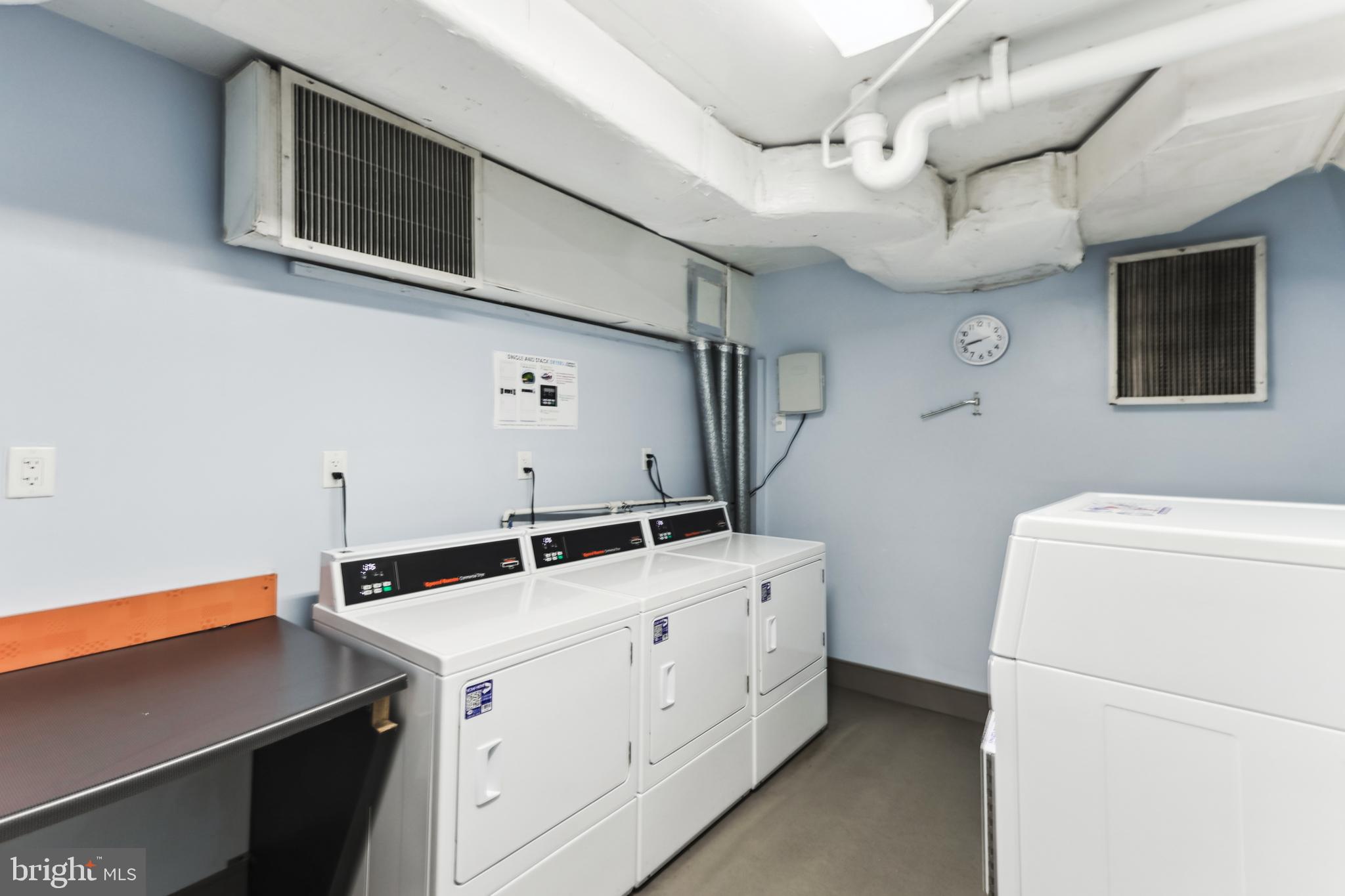 2939 Van Ness Street Northwest, Unit 630 Washington, DC 20008 - Photo 16 of 25 a utility room with dryer and washer