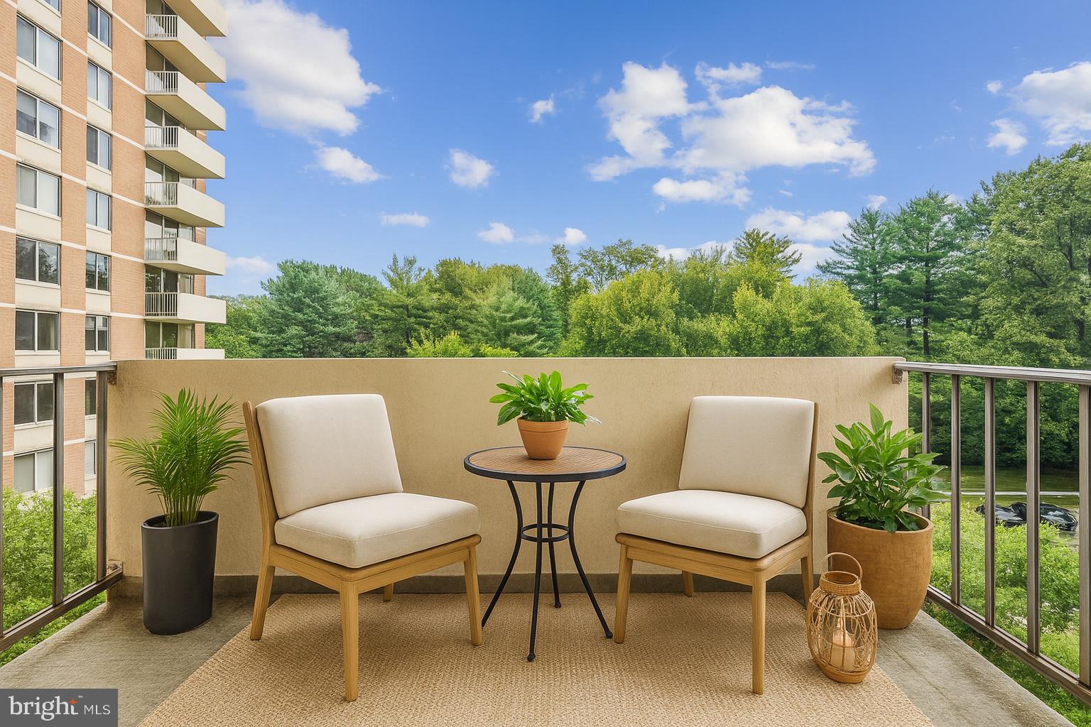 2939 Van Ness Street Northwest, Unit 630 Washington, DC 20008 - Photo 3 of 25 a view of a chairs and table in the backyard