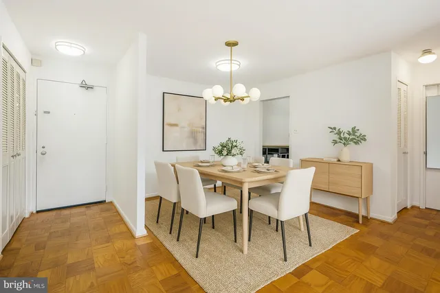 a view of a dining room with furniture and wooden floor