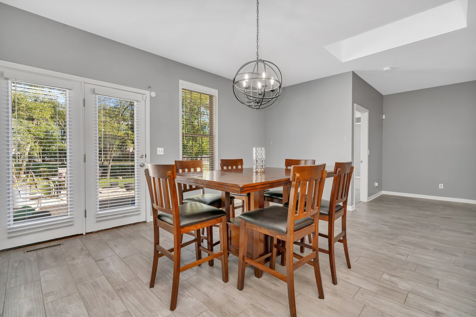 1801 Red Willow Road Morris, IL 60450 - Photo 15 of 29 a view of a dining room with furniture wooden floor and chandelier