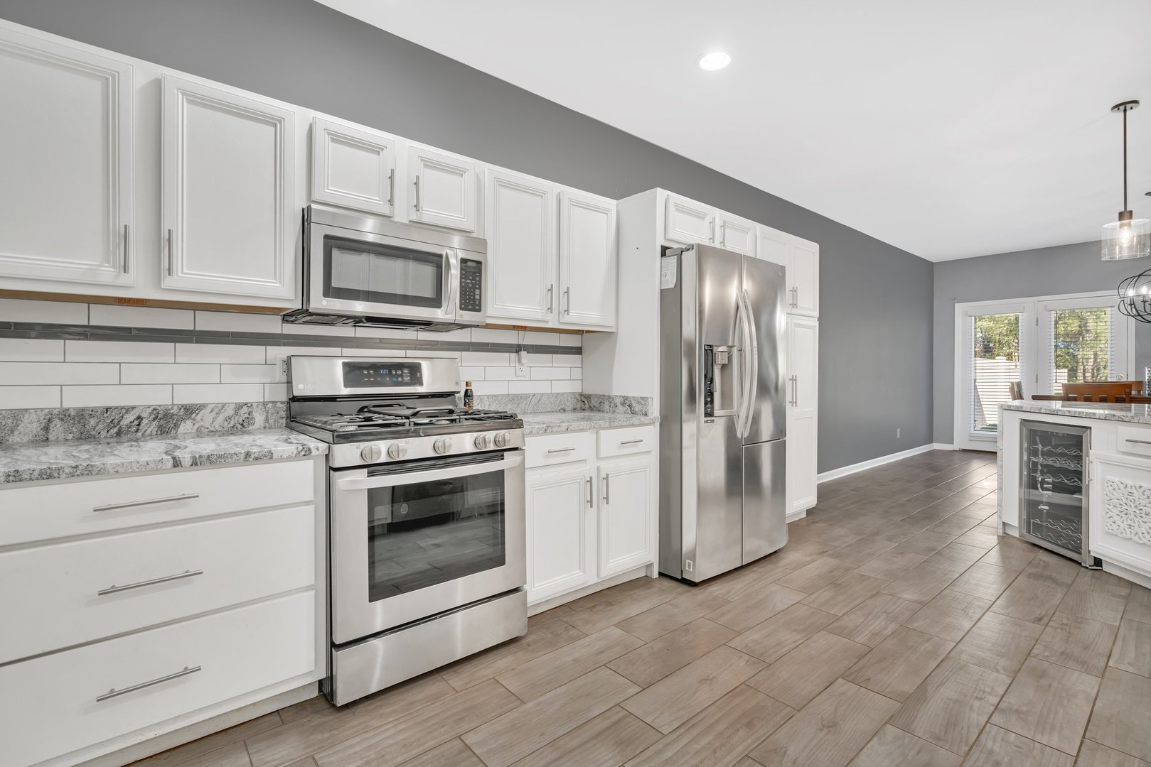 1801 Red Willow Road Morris, IL 60450 - Photo 9 of 29 a kitchen with granite countertop white cabinets and stainless steel appliances