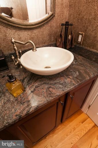 13763 Bottom Road Hydes, MD 21082 - Photo 22 of 30 Powder Room off Foyer with hardwoods & custom sink