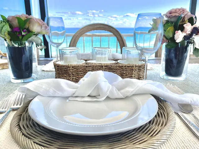 a very nice looking living room with furniture and floor to ceiling windows