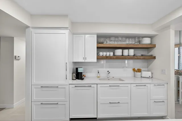 a view of a dining room with furniture large windows and wooden floor