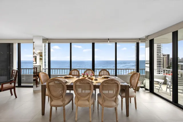 a bathroom with a granite countertop sink mirror and shower