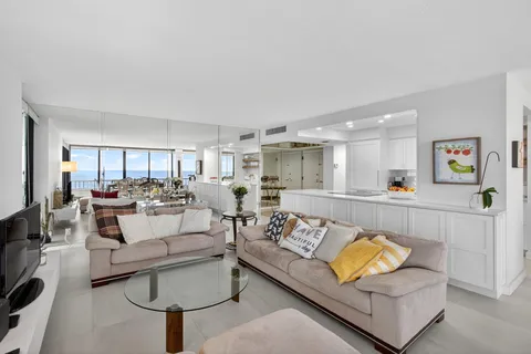 a bedroom with two beds and painting on the wall