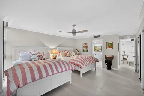 a living room with fireplace furniture and a large window