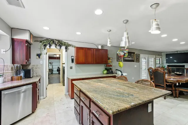 a bathroom with a sink mirror and toilet
