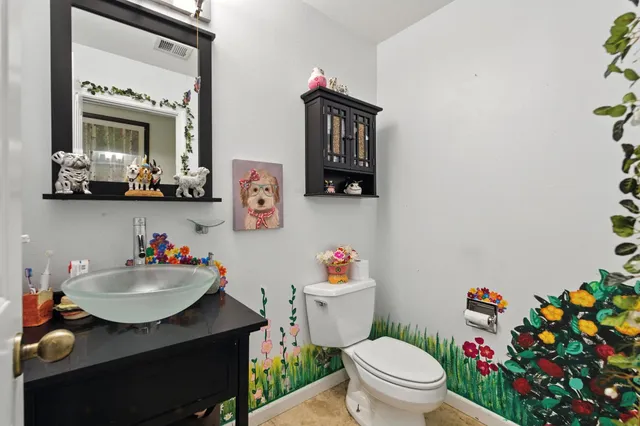 a view of a chair and tables in the backyard