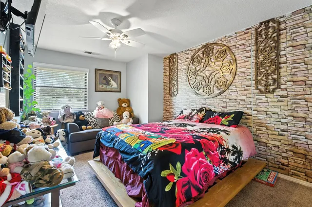 a view of a backyard with plants and a patio