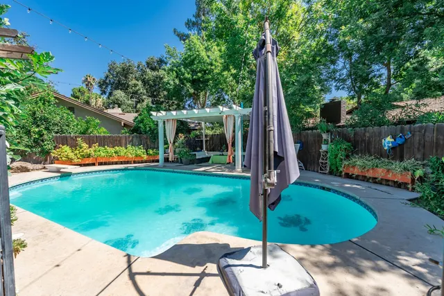 an aerial view of a house with outdoor space