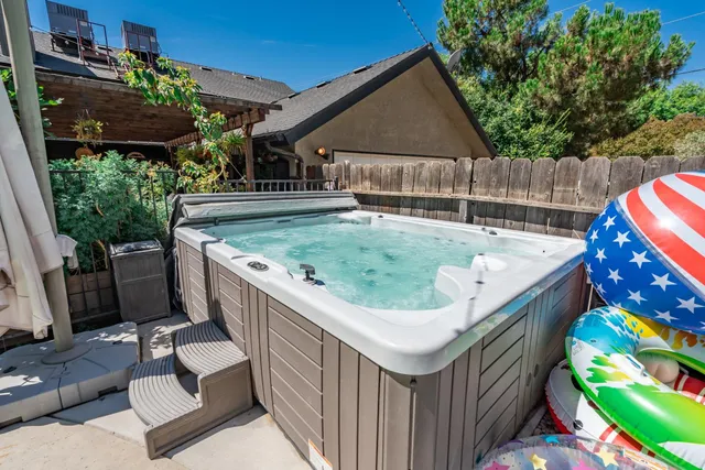 an aerial view of a house with outdoor space