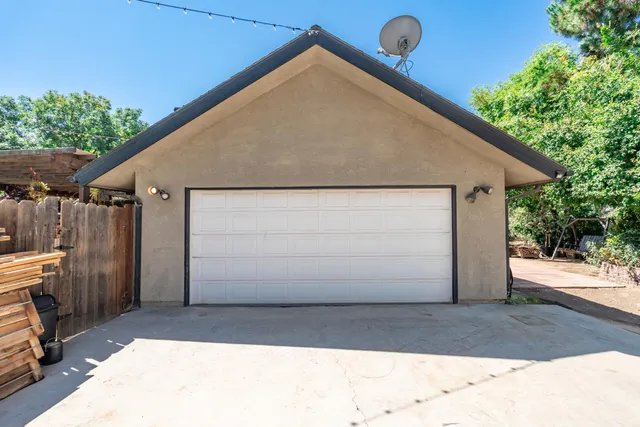 a living room filled with furniture and a potted plant