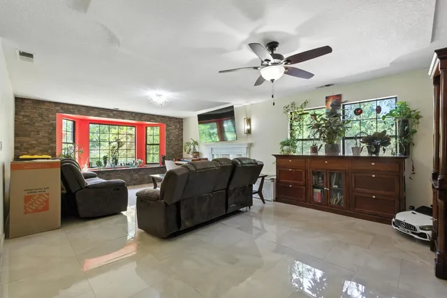 a kitchen with stainless steel appliances granite countertop sink stove and refrigerator