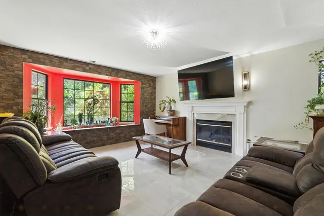 a kitchen with a sink and large window