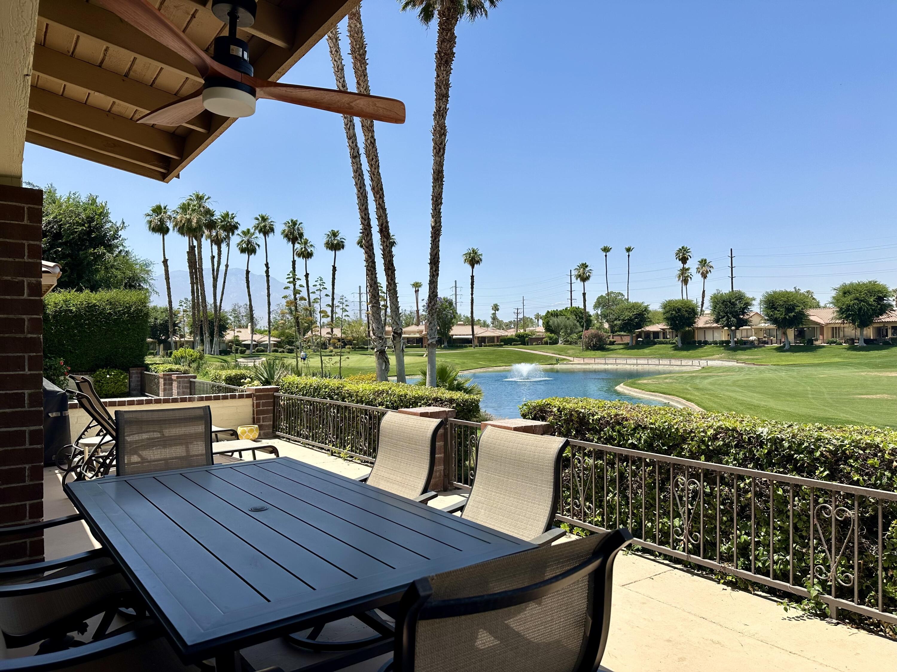 214 La Paz Way Palm Desert, CA 92260 - Photo 1 of 15 a view of a chairs and table on the terrace