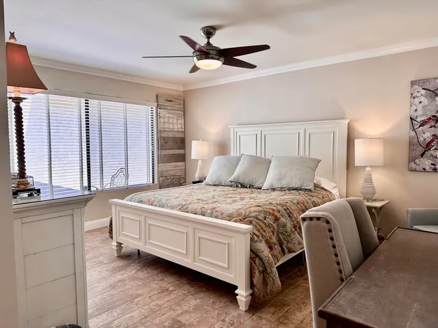 a bedroom with bed and window