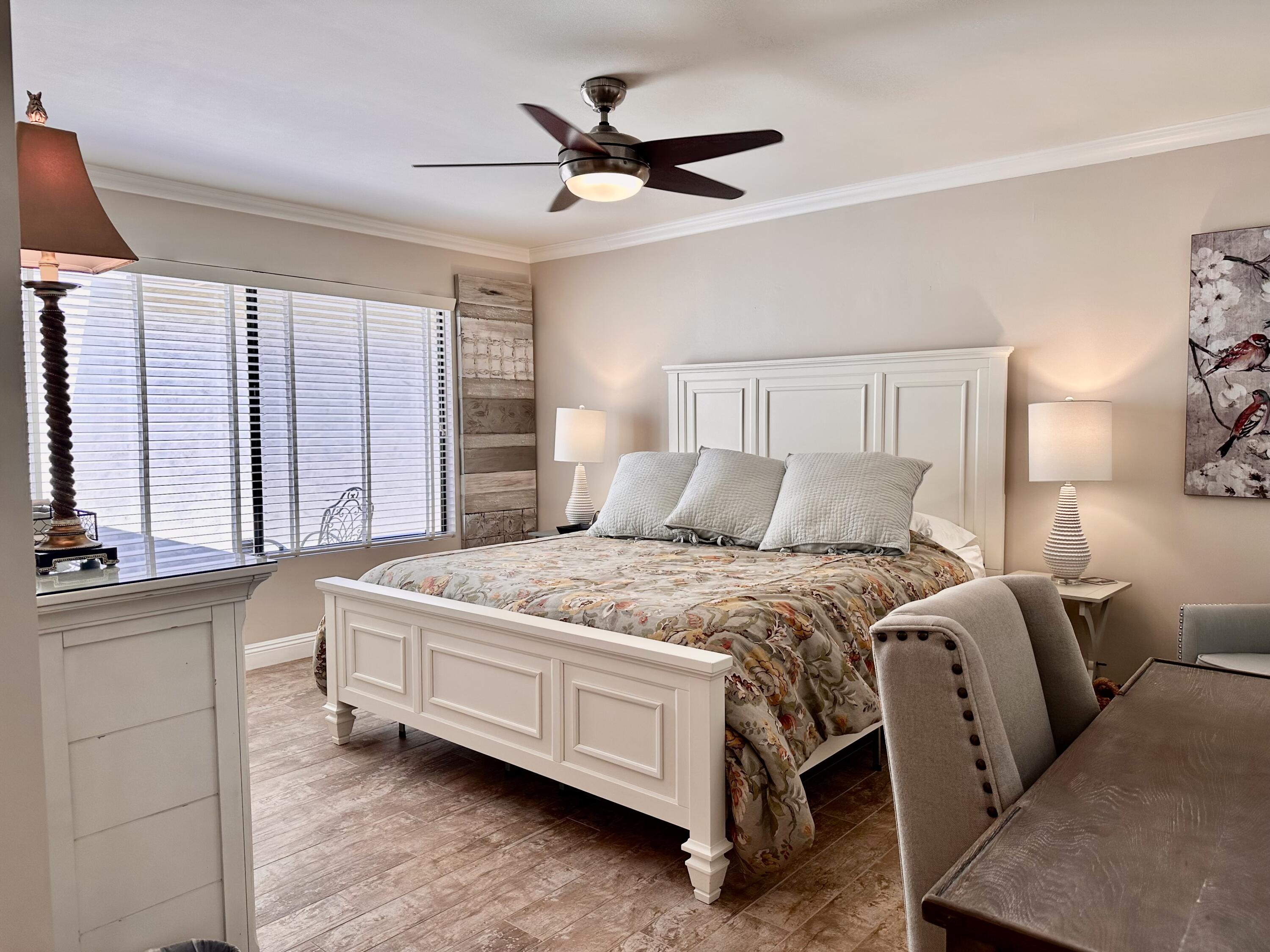 214 La Paz Way Palm Desert, CA 92260 - Photo 11 of 15 a bedroom with bed and window