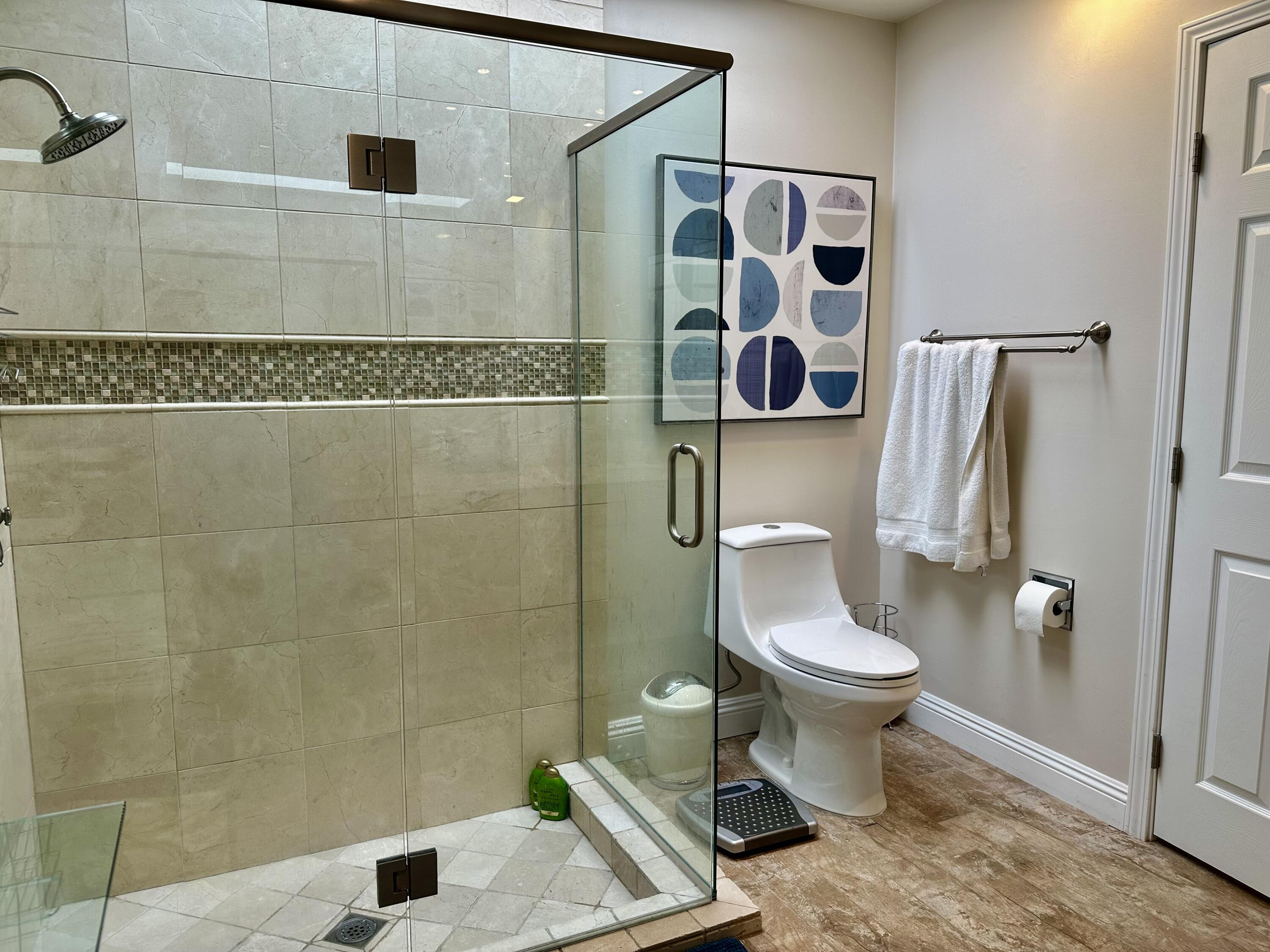 214 La Paz Way Palm Desert, CA 92260 - Photo 14 of 15 a bathroom with a toilet and a shower