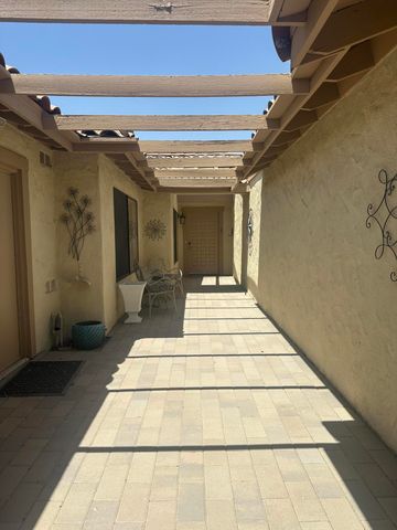 a view of a balcony with furniture