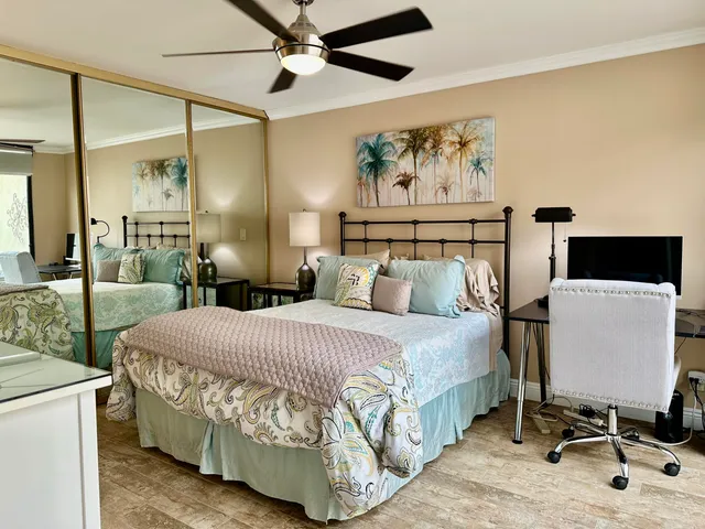 a bed room with a bed window and a chair