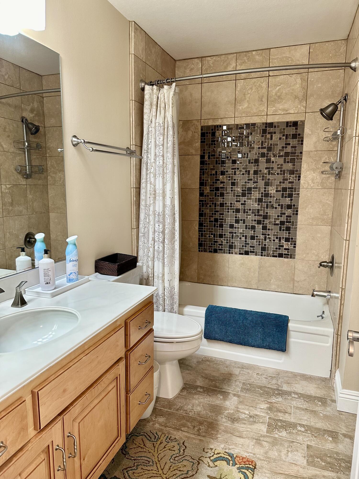 214 La Paz Way Palm Desert, CA 92260 - Photo 9 of 15 a bathroom with a sink a toilet and shower