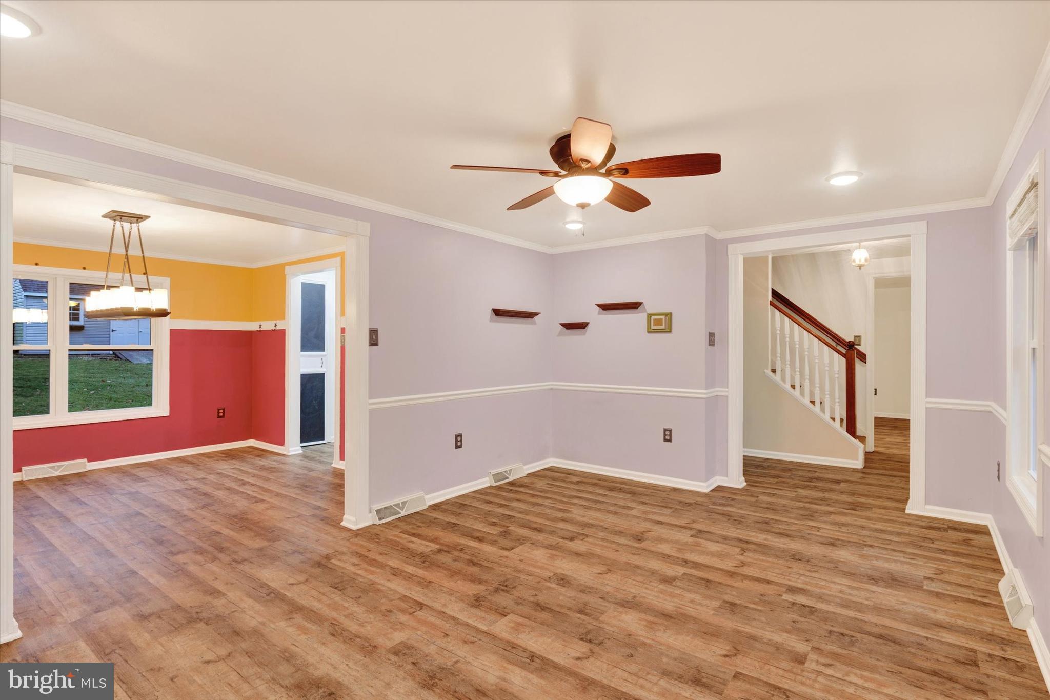 477 Longmeadow Road Lancaster, PA 17601 - Photo 3 of 28 a view of an empty room with wooden floor and a window