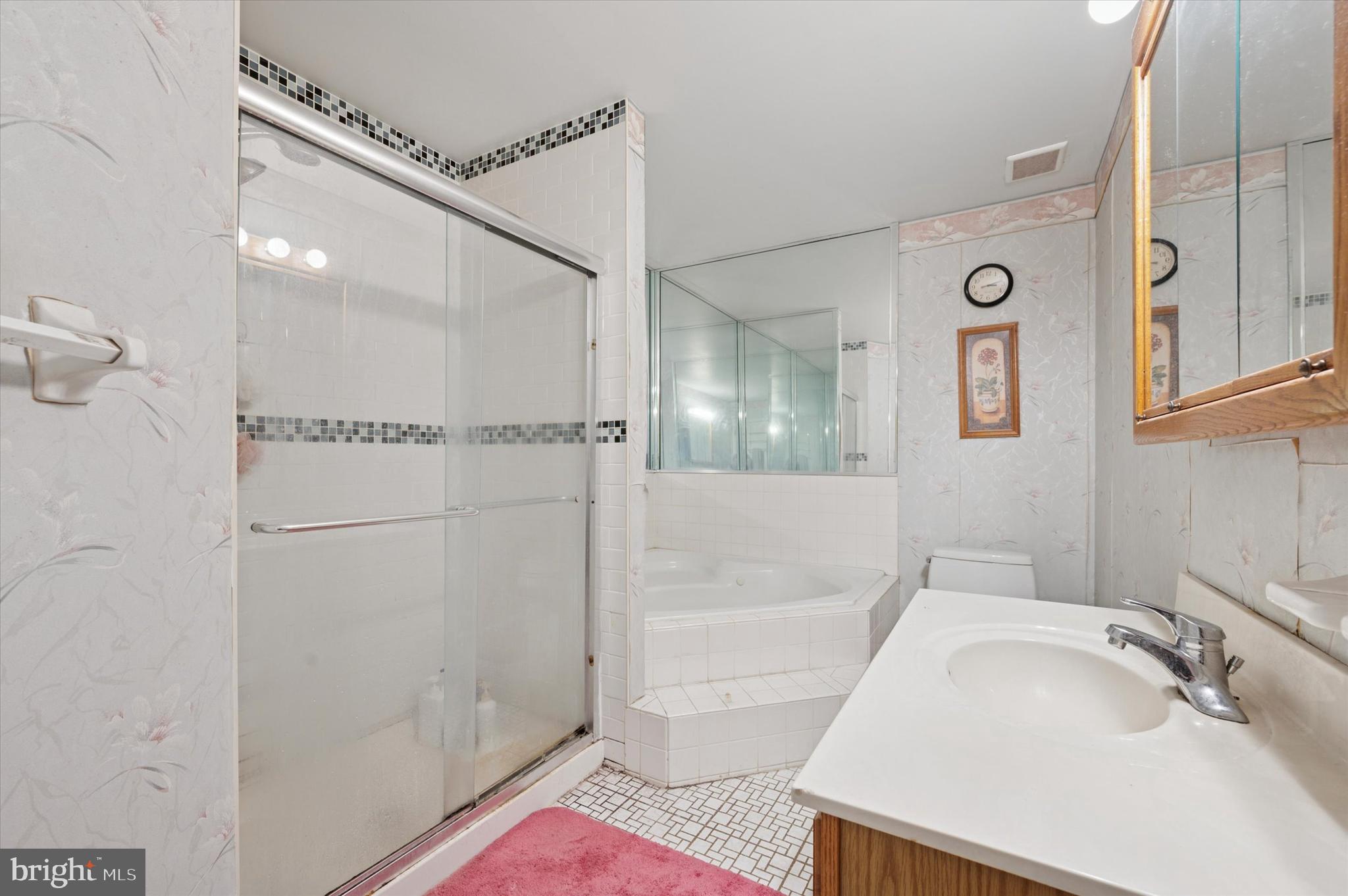 12818 Galdi Lane Philadelphia, PA 19154 - Photo 22 of 25 a bathroom with a bathtub and a shower