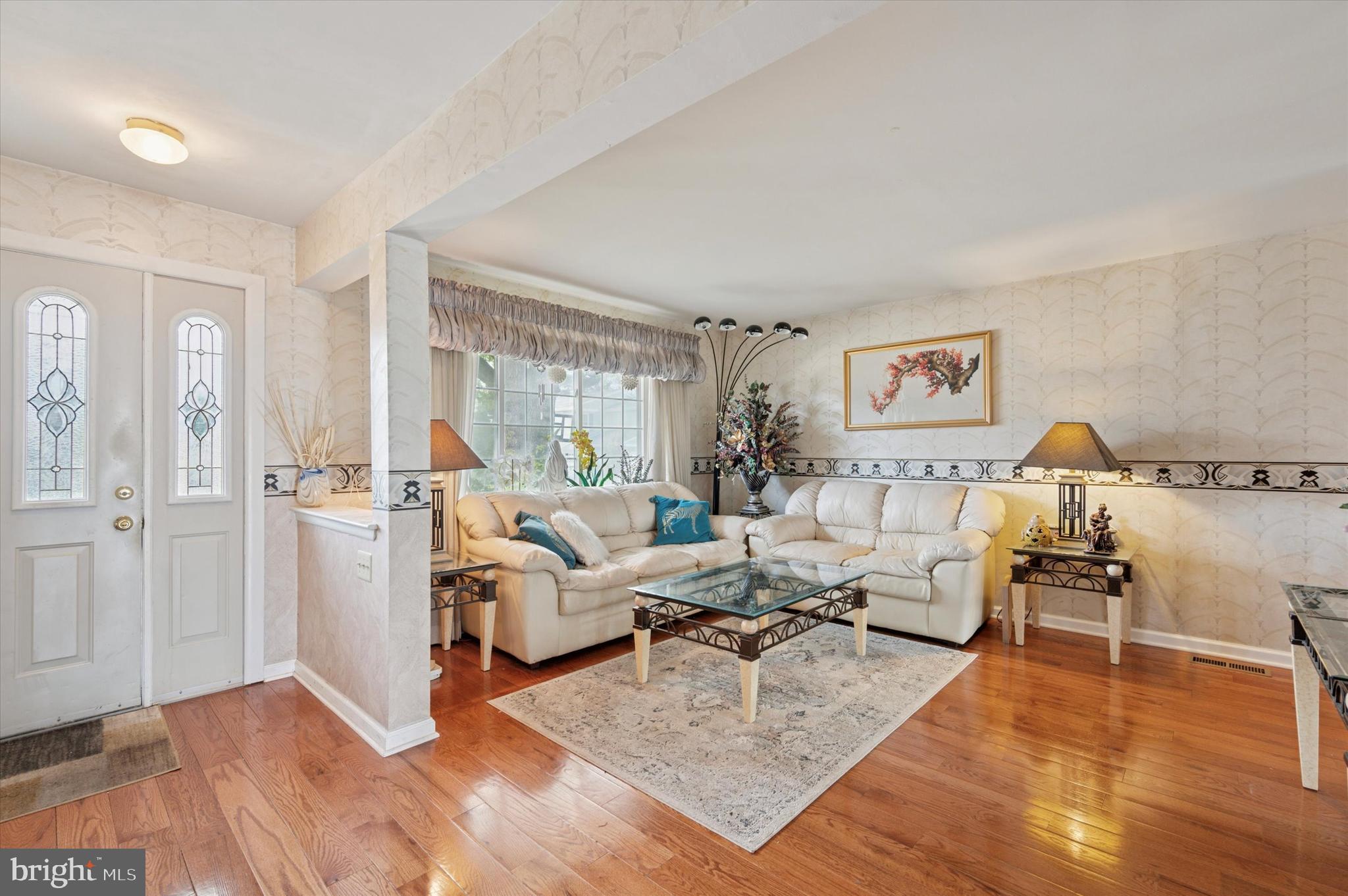 12818 Galdi Lane Philadelphia, PA 19154 - Photo 3 of 25 a living room with furniture and a table