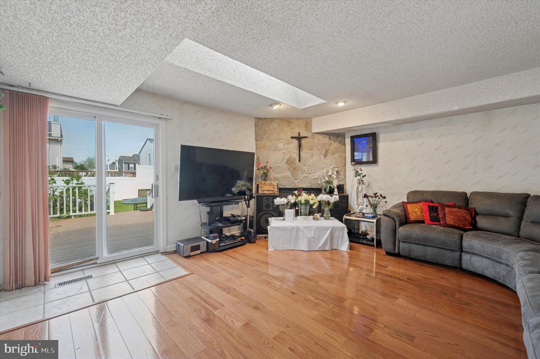 12818 Galdi Lane Philadelphia, PA 19154 - Photo 7 of 25 a living room with furniture and a flat screen tv