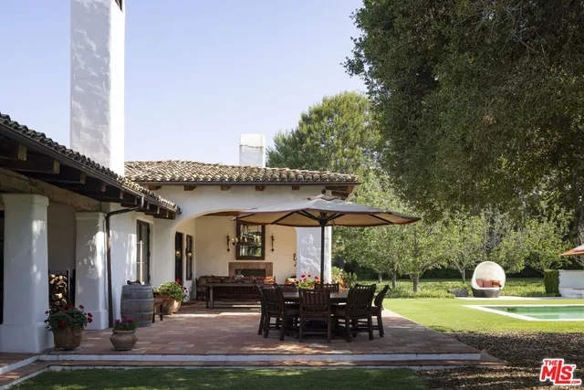 a patio with table and chairs