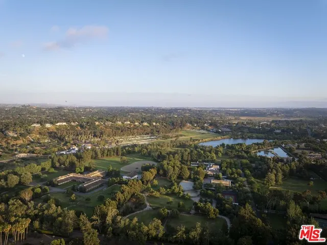 an aerial view of residential house and lake