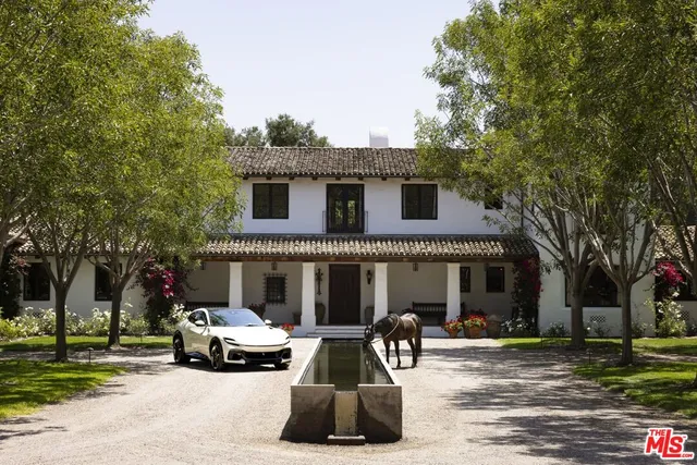 a view of a car parked in front of a house